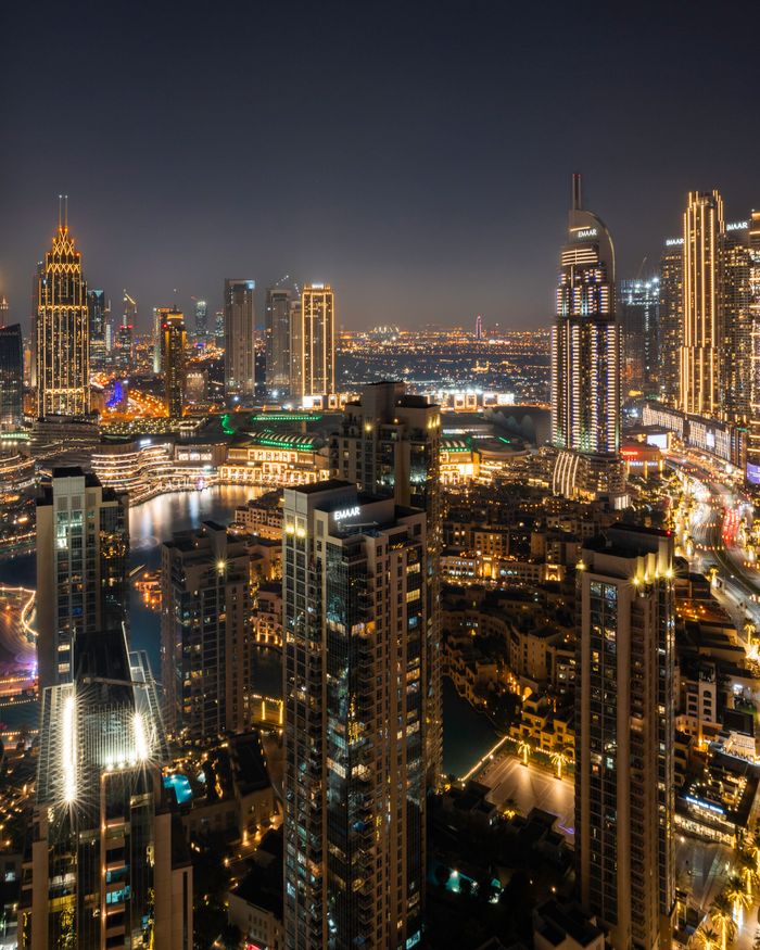 Captivating view of Dubai's illuminated skyline featuring iconic skyscrapers at night.